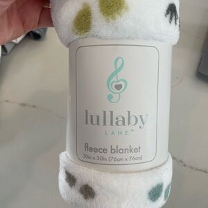 Lullaby Lane Fleece Blanket with Multicolor Paw Prints